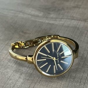 Black and gold dainty watch